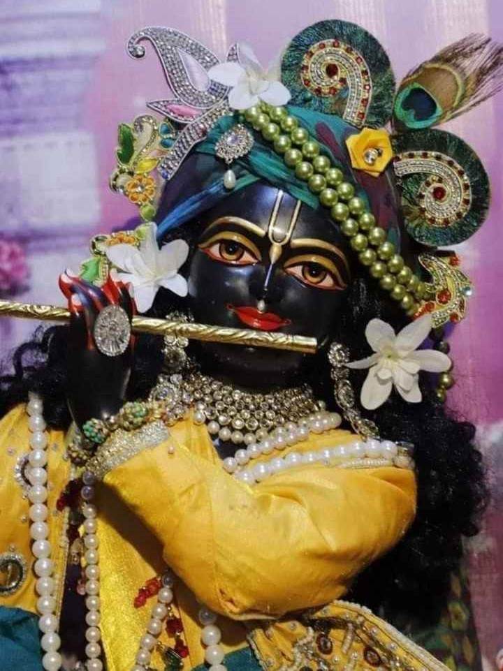 wallpaper of Lord Krishna playing his flute.